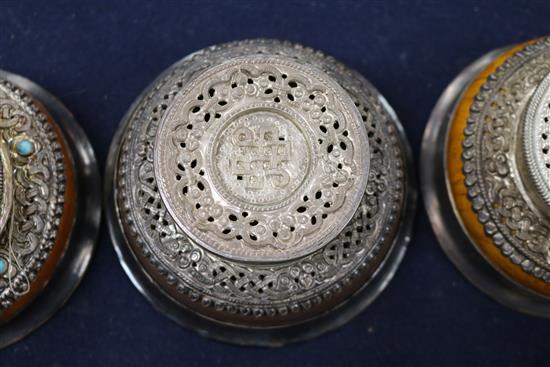 Four Tibetan white metal and wood bowls largest 10cm